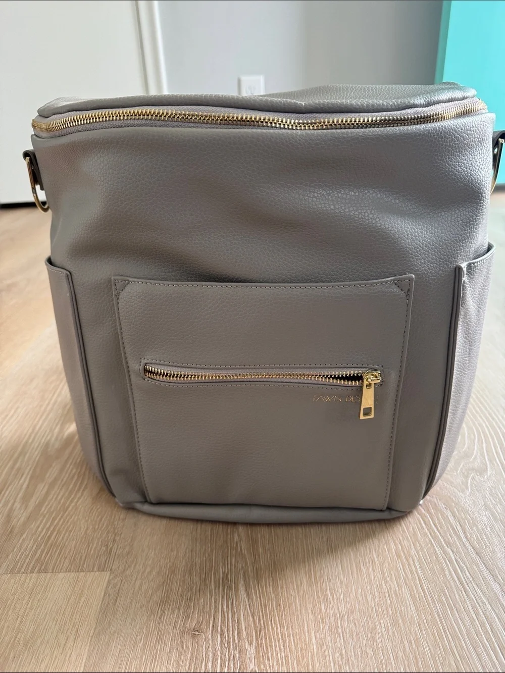 Fawn Design Cream Convertible Diaper Backpack with Gold Hardware